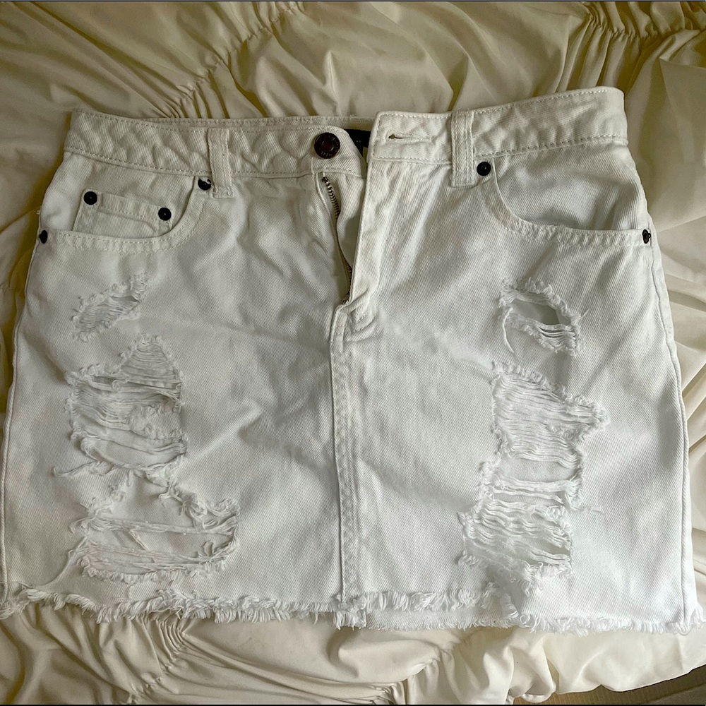 torn white jean skirt